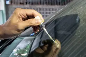 Close up of a windshield scratch repair