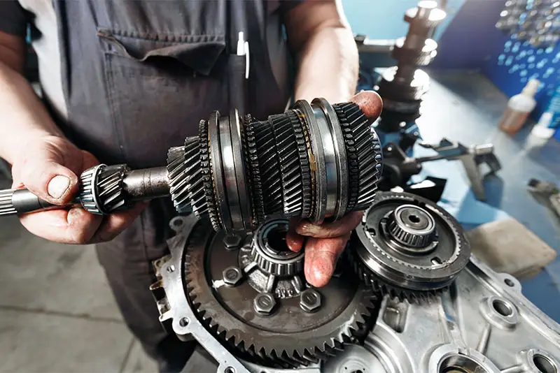 Mechanic servicing a transmission